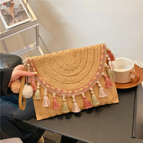 Boho style straw woven tassel shoulder bag for beach and summer outfits